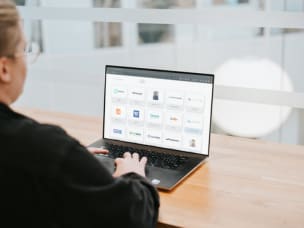 Employee in office looks at Awin's 2024 Power 100 list of the most unique partners 