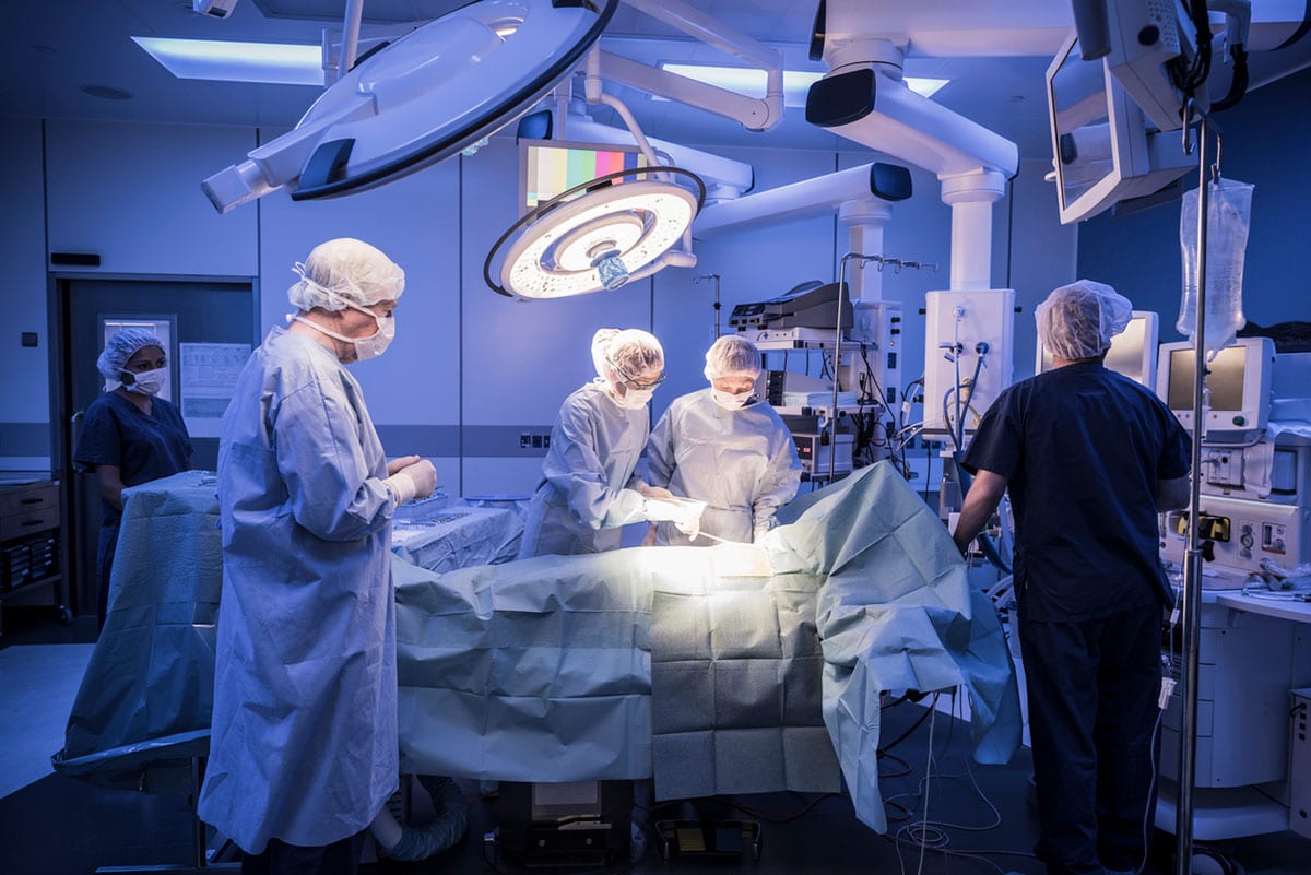 An operating theatre with a transplant patient on the table.