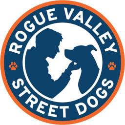 Rogue Valley Street Dogs Logo with person and dog in the center.