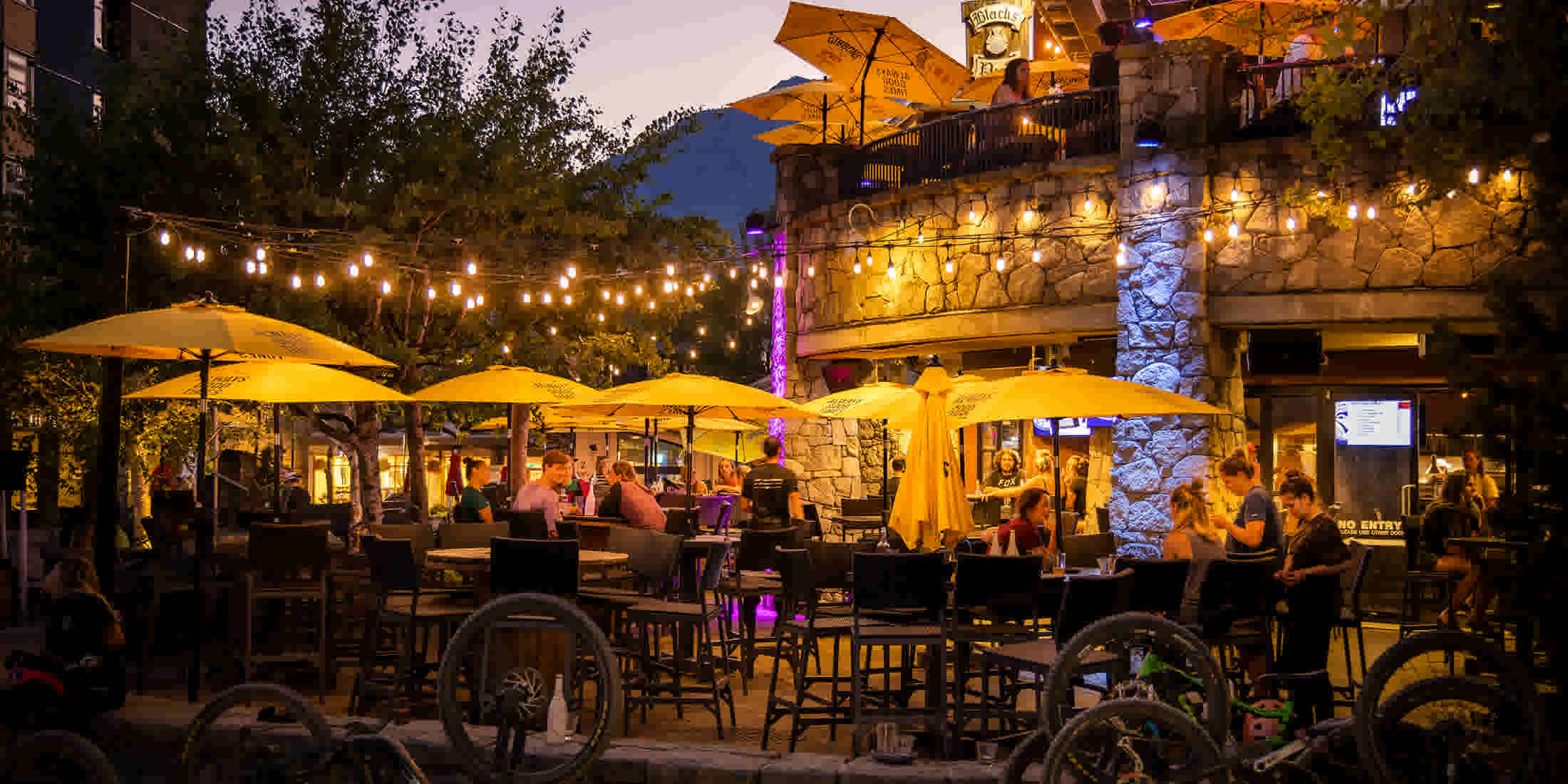 Summertime apres on the patio at Black's in Whistler Village